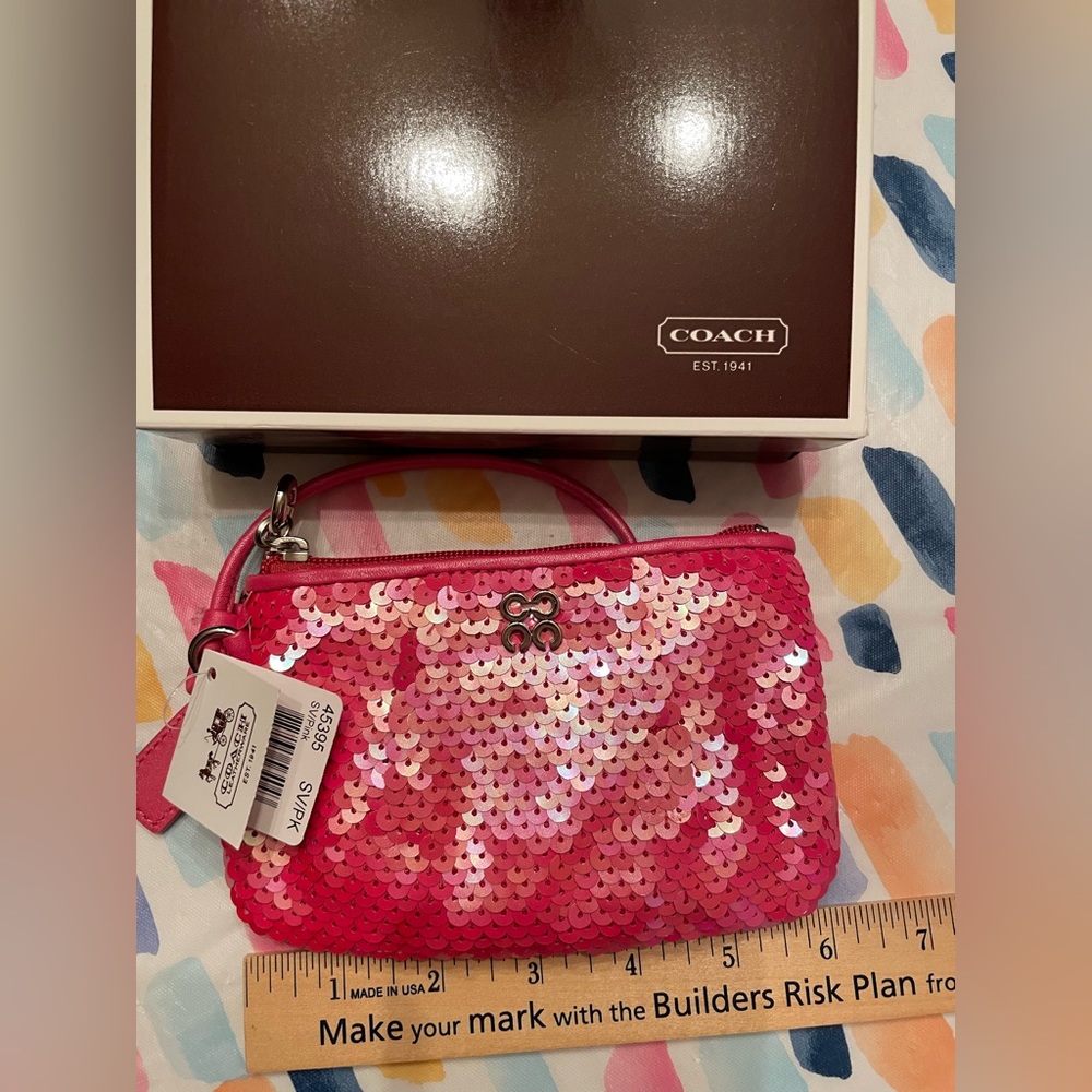 NWT: Coach Special edition pink sequin wristlet.